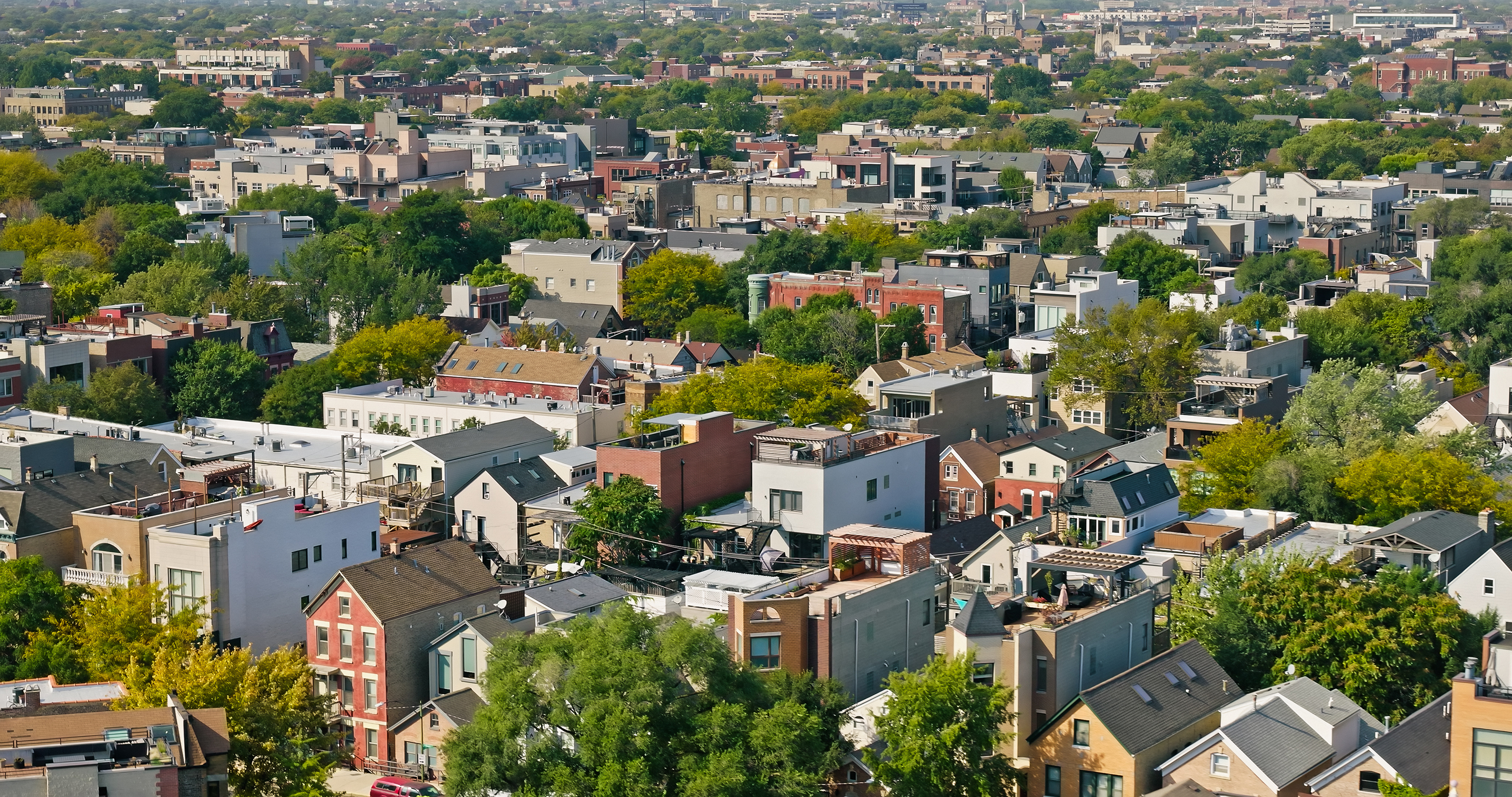 Aerial shot of residential buildings in Chicago, Illinois on a clear day in Fall.